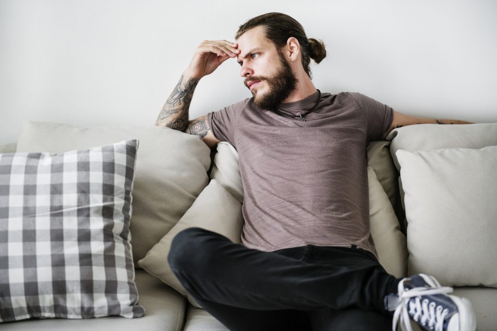 student sitting and looking upset he doesn't know more about loans